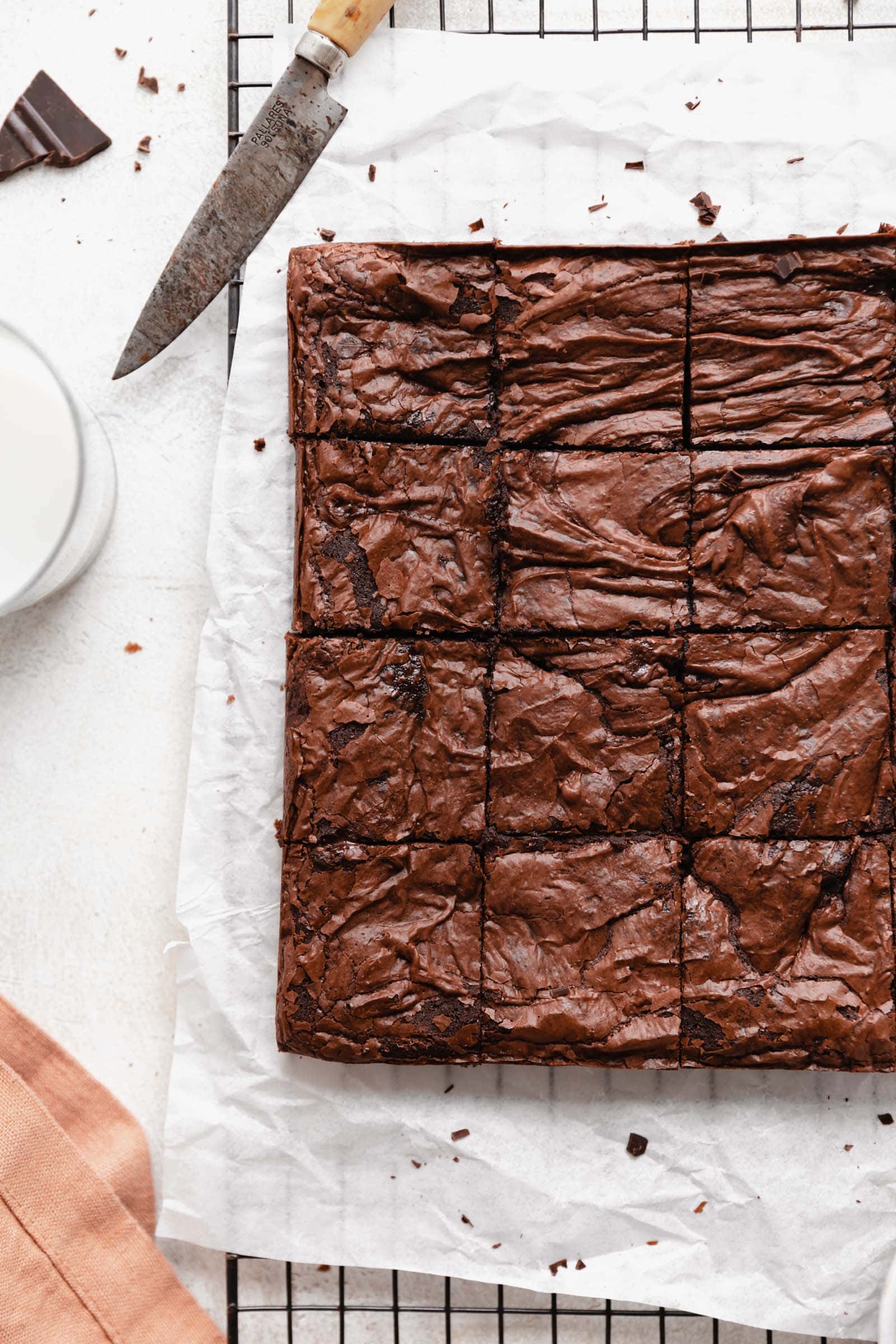 borwnies cut into squares on parchment paper