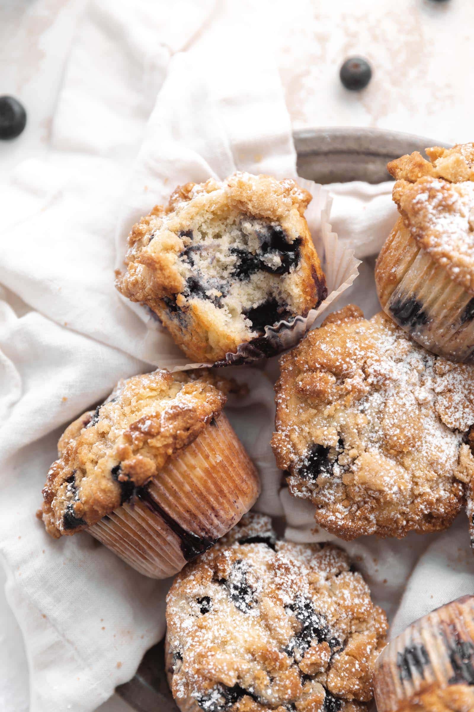 blueberry streusel muffins with a bite taken out