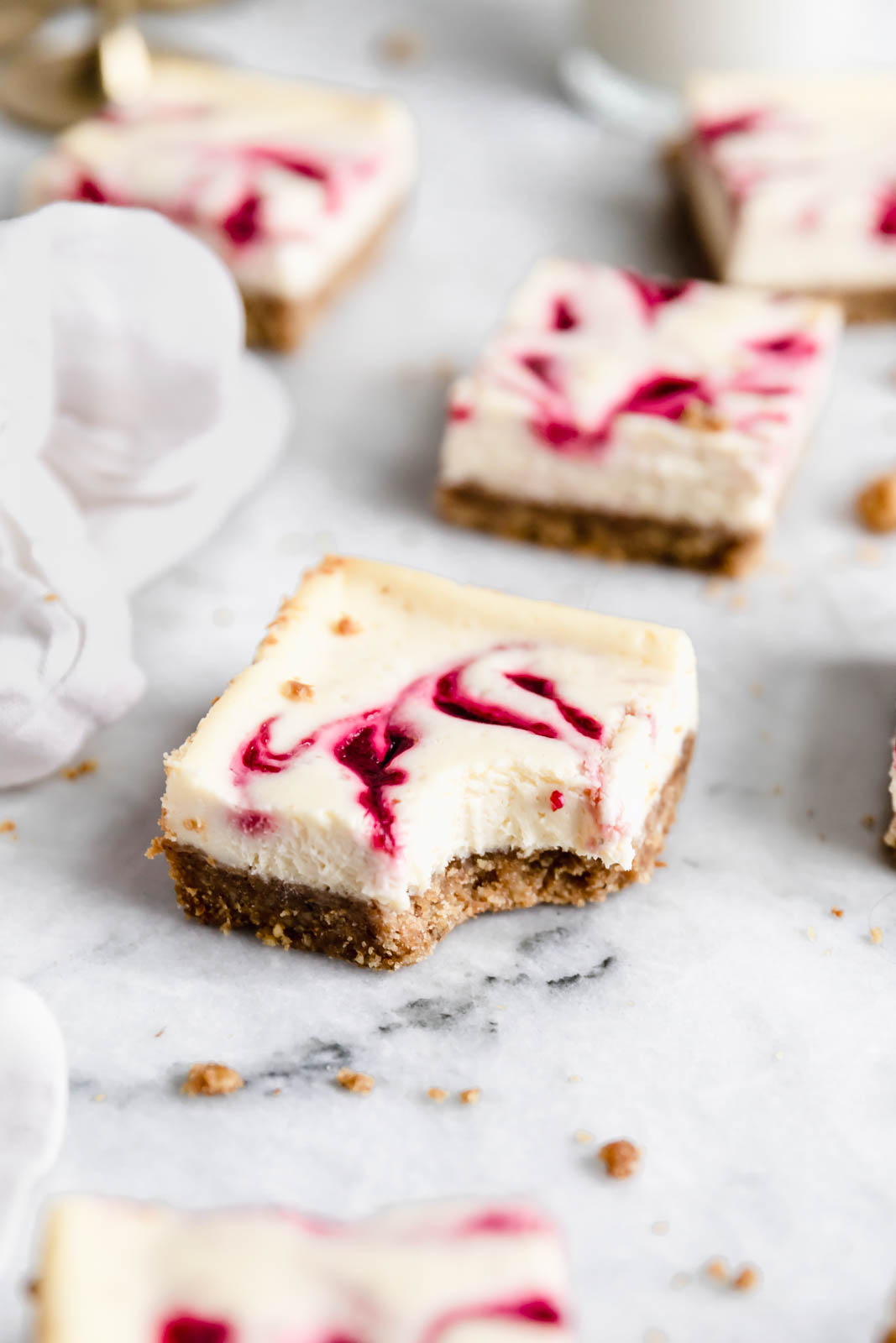 Walnut Cranberry Cheesecake Bar with bite taken out