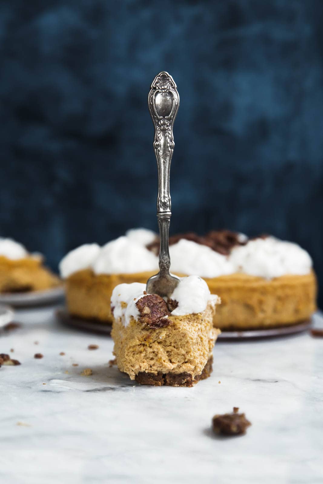 pumpkin cheesecake slice with a fork in it