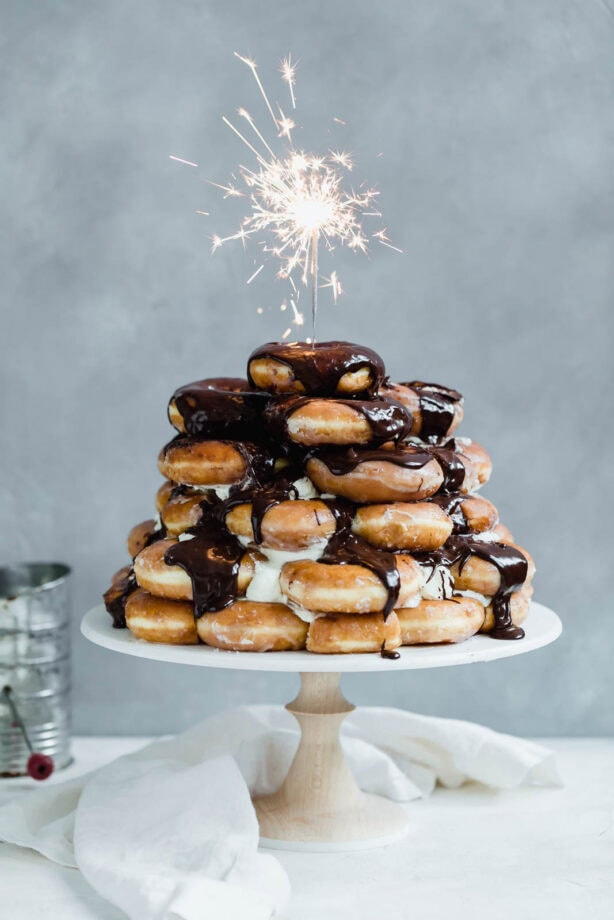 Krispy Kreme Doughnut Cake: a cake made entirely of Krispy Kreme doughnuts and drizzled with chocolate fudge sauce. I’ve died and gone to heaven.