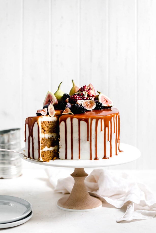 One bite of this Pumpkin Cake and you'll never want another cake ever again. Topped with the best cream cheese frosting and a salted caramel drizzle.