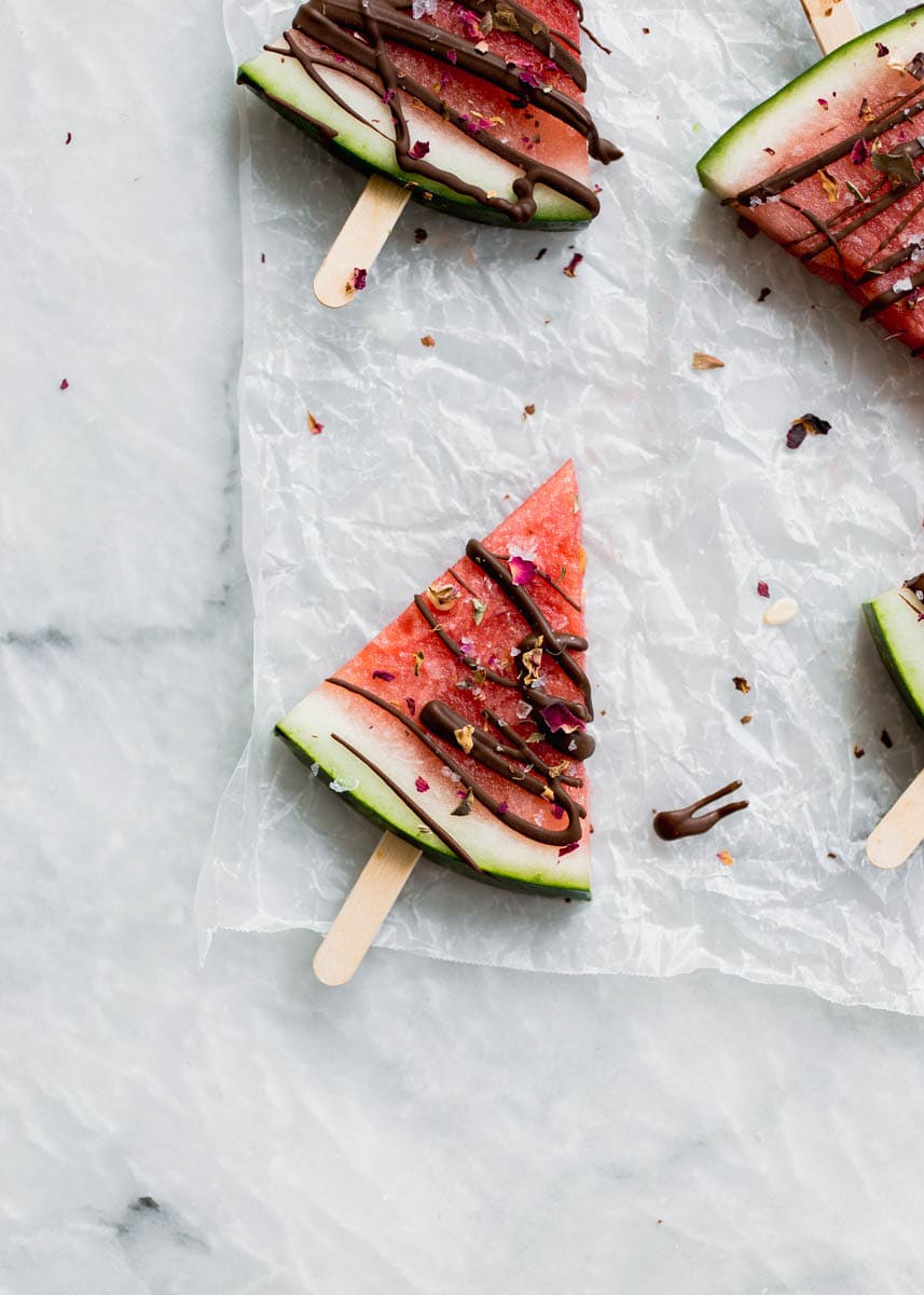 Low in sugar and totally refreshing, these fresh watermelon popsicles drizzled with chocolate and sea salt are the perfect treat on a hot summer's day! 